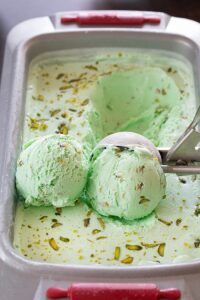 Scoops of pistachio Ice cream in a tub