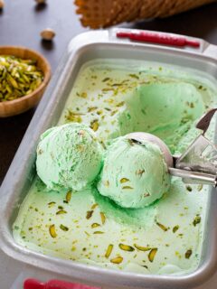Scoops of pistachio Ice cream in a tub