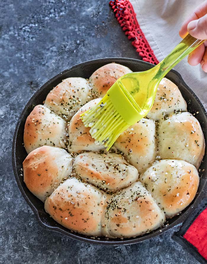 Brush the skillet rolls with butter
